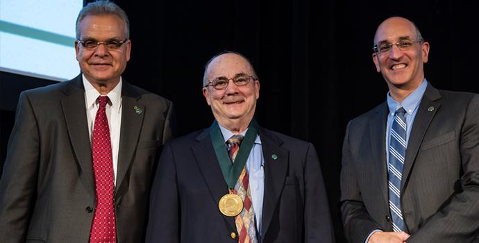 Robert Vince is honored onstage for his National Academy of Inventors Fellowship
